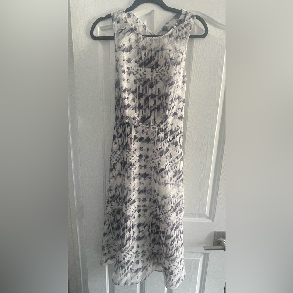 Antonio Melani dress with a cute small cutout in the back . ivory and navy.